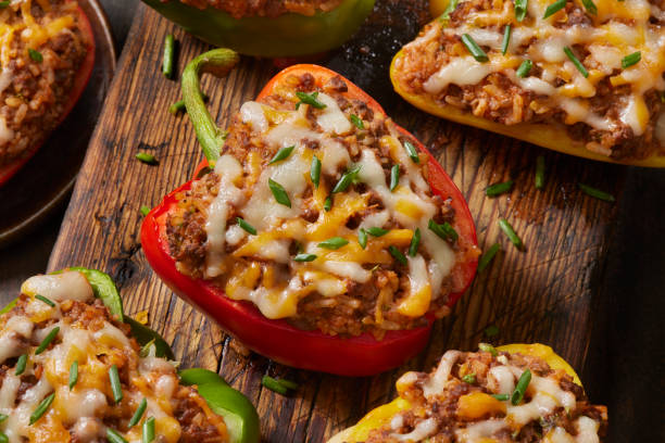 Italian Style Stuffed Peppers Italian Style Stuffed Peppers with Ground Beef, Rice, Tomato Sauce and Cheese stuffed pepper stock pictures, royalty-free photos & images