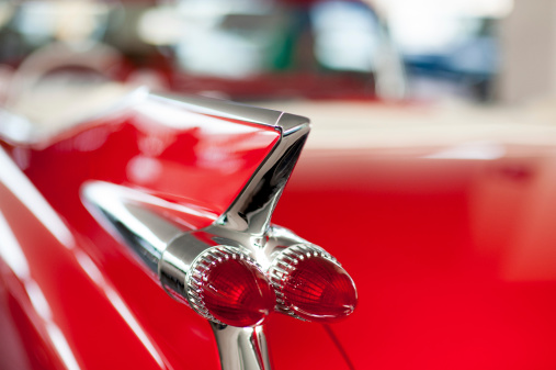Detail of the rear left light of one old classic car