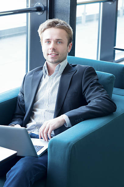 istock Portrait of business man using laptop 166398143