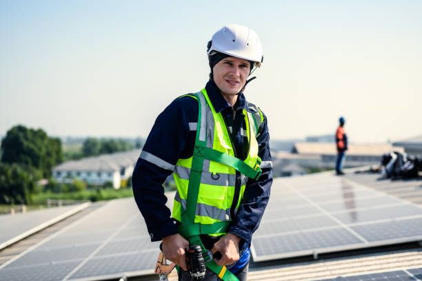 istock Engineers with safety helmet checking solar system at solar power farm 1664004368