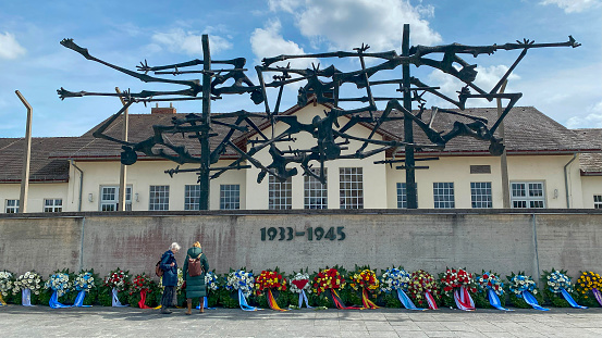 Wreaths of flower lay after a memorial ceremony commemorating the liberation day in Dachau concentration camp, Bavaria, Germany