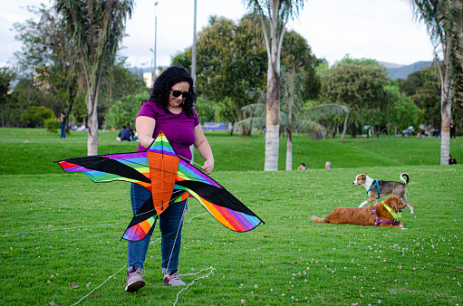middle aged woman flying a kite