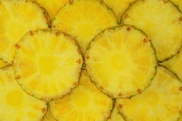 istock Pineapple juicy yellow slices as a background. 1664023197