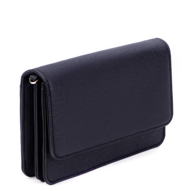 istock Classy women's black saffiano leather clutch isolated against a white background with space for text. Mock-up for advertising poster, discount promotion, sale. Concept of versatile accessories. 1664027147