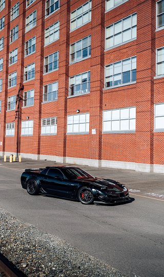 Seattle, WA, USA
September 6, 2023
Black Corvette Z06 parked below a brick building