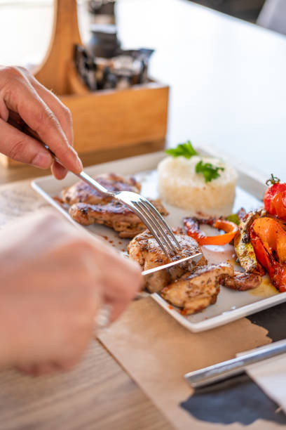 istock person eating grilled chicken 1664049055