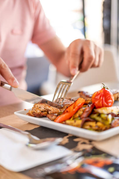 istock person eating grilled chicken 1664050257