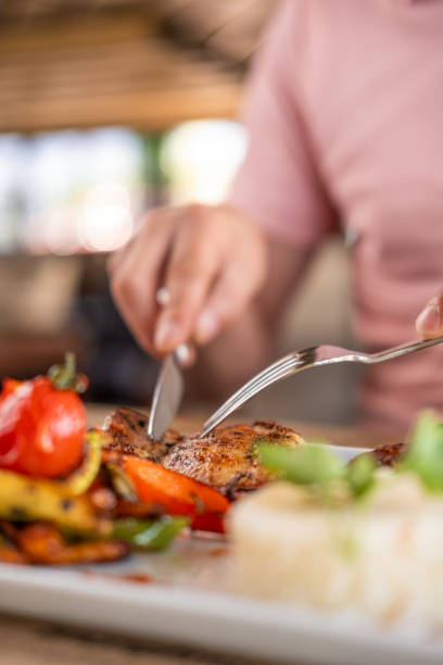 istock person eating grilled chicken 1664050808