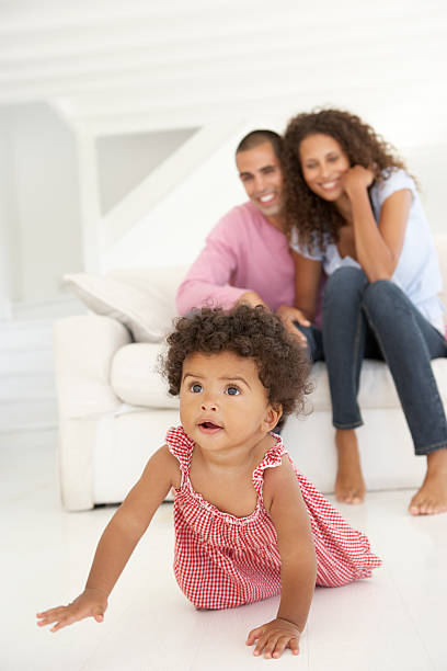 istock Young Family Relaxing On Sofa 166408979