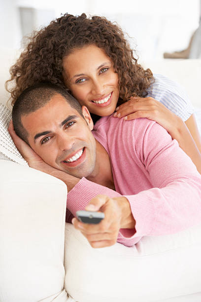 istock Young Couple Watching TV 166408986