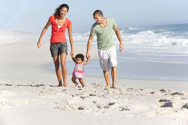istock Family Having Fun On Beach 166409041