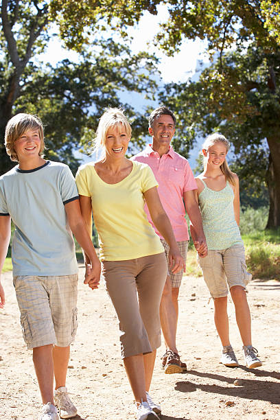 istock Middle Aged Family Walking Through Countryside 166409208