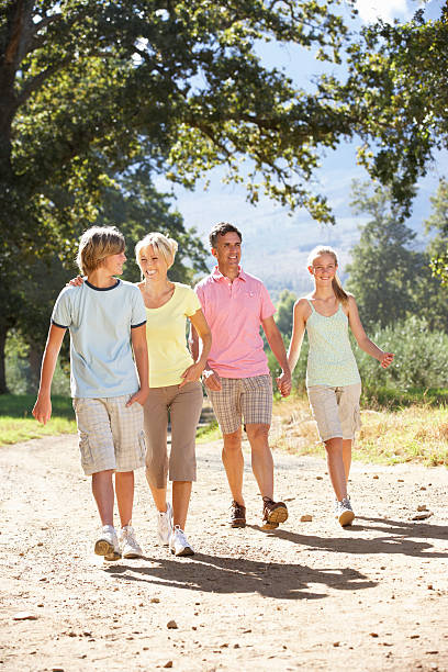 istock Middle Aged Family Walking Through Countryside 166409233