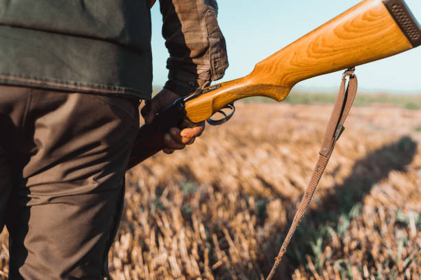 istock Hunter holding a shotgun in his hand 1664108109