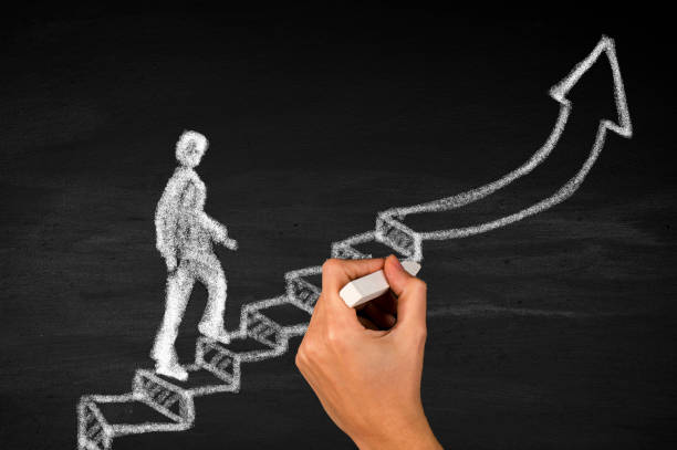 istock Businessman climbing stairs to success 1664115256
