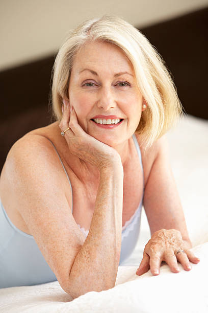 istock Senior Woman Relaxing On Bed 166412021