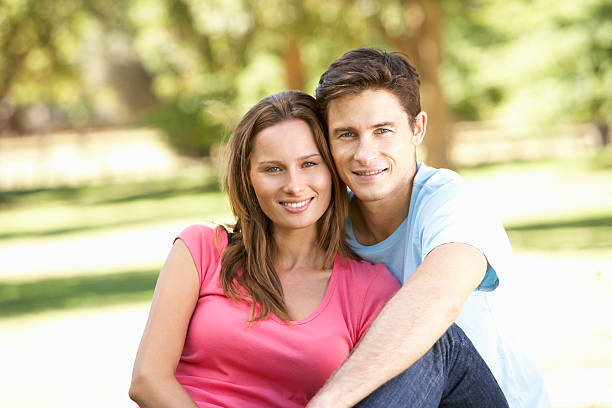 istock Young Couple Relaxing In Park 166412278