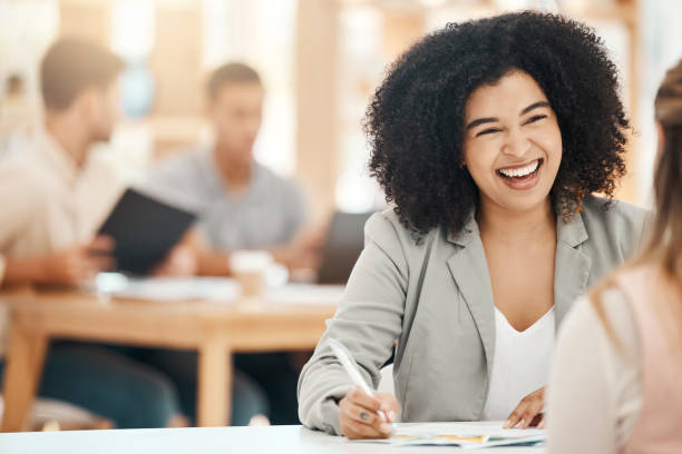 istock Happy black woman writing notes in office meeting, planning and strategy development with business motivation, happiness and mission for goals. Smile young business professional conversation at desk 1664122822