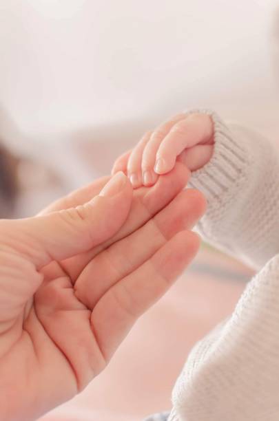 istock A baby taking her mom's hand 1664138749