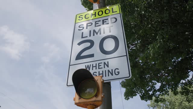 Twenty Miles Per House Sign by School When Flashing