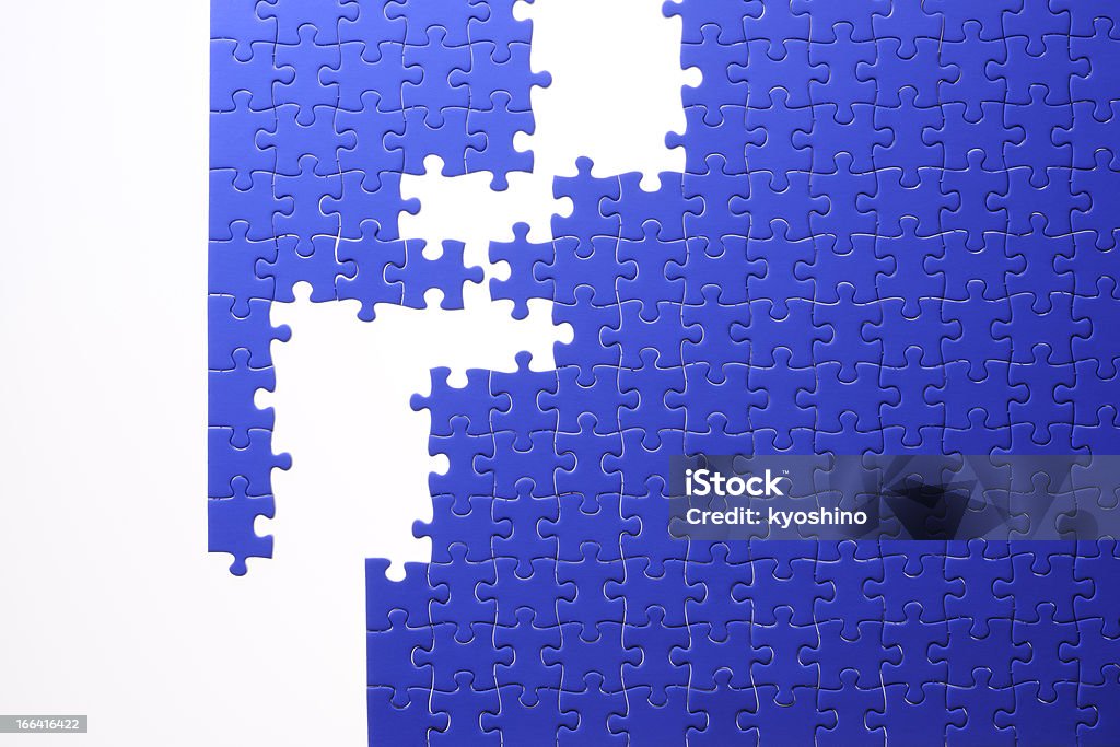 絶縁ショットブルーのジグソーパズル背景に白色 - おもちゃのロイヤリティフリーストックフォト