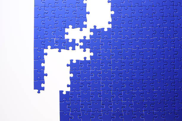 istock Isolated shot of blue jigsaw puzzle on white background 166416422