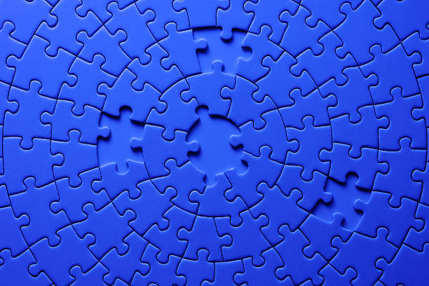 istock Missing piece of blank blue jigsaw puzzle against blue background 166416515