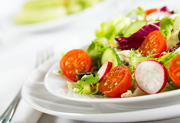 istock salad with fresh vegetables and greens 166416884