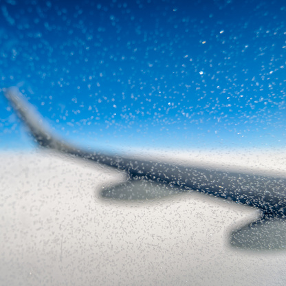 Ice crystals on the window of an airplane in flight
