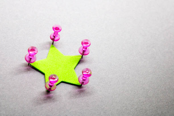 Group of thumbtacks forming a star
