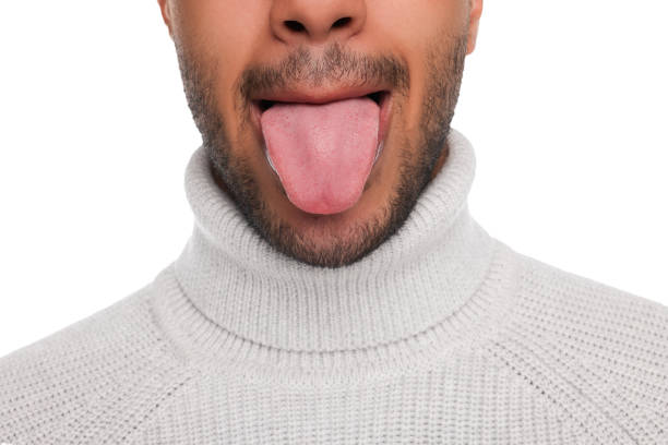 istock Man showing his tongue on white background, closeup 1664208482