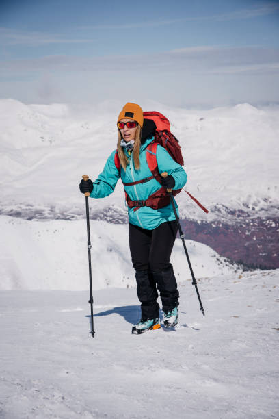 istock Woman mountain climbing 1664208509