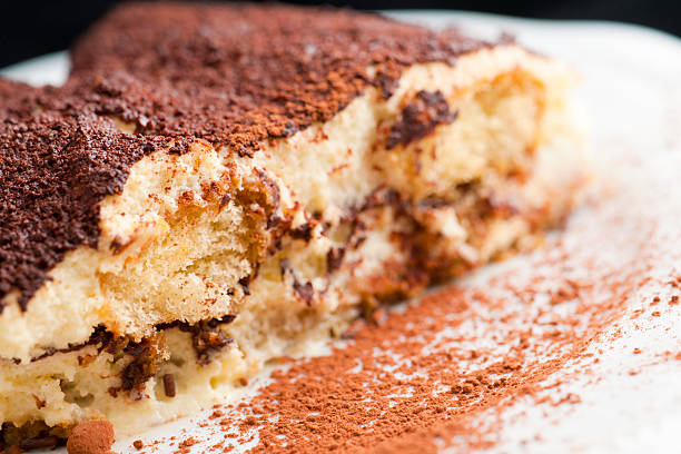Real Fresh Homemade Tiramisu Closeup on Black Background