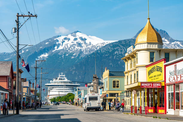 Skagway townscape in the morning, Alaska, USA Skagway, Alaska - July 30, 2023: Tourists are walking on the street for shopping. Skagway townscape in the morning, Alaska, USA. alaska gold rush stock pictures, royalty-free photos & images