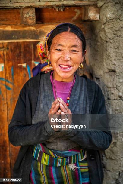 Namaste Portrait Of Tibetan Woman Upper Mustang Nepal Stock Photo - Download Image Now