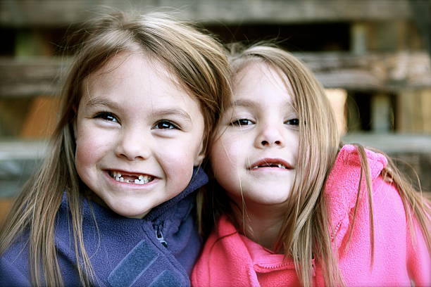 istock Happy Twin Girls 166429799
