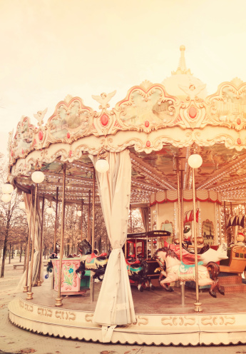 Vintage carousel horse in the sun. Childhood memories.