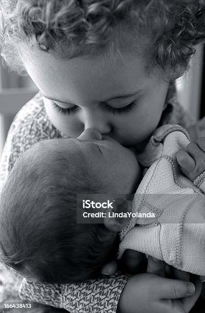 Little Boy Kissing Newborn Brother Stock Photo - Download Image Now - 0-1 Months, 0-11 Months, Affectionate