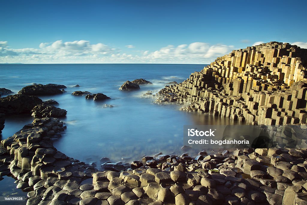 Beautiful sunny afternoon at the famous Giant's Causeway Beautiful sunny afternoon at the famous Giant's Causeway on the Antrim Coast of Northern Ireland Giants Causeway Stock Photo