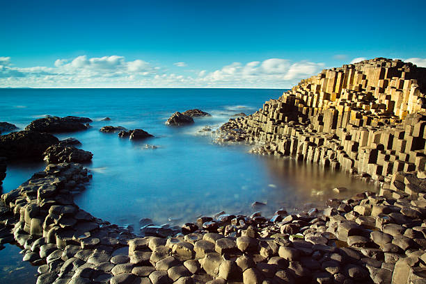 Beautiful sunny afternoon at the famous Giant's Causeway Beautiful sunny afternoon at the famous Giant's Causeway on the Antrim Coast of Northern Ireland giants causeway photos stock pictures, royalty-free photos & images