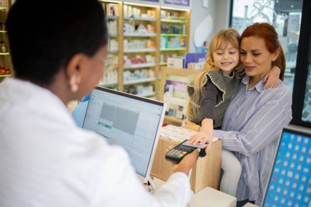 istock Mother and daughter at the pharmacy 1664402714