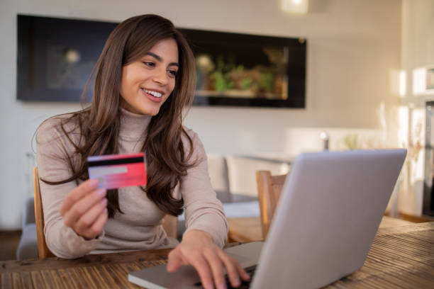 Happy young customer enjoys shopping online