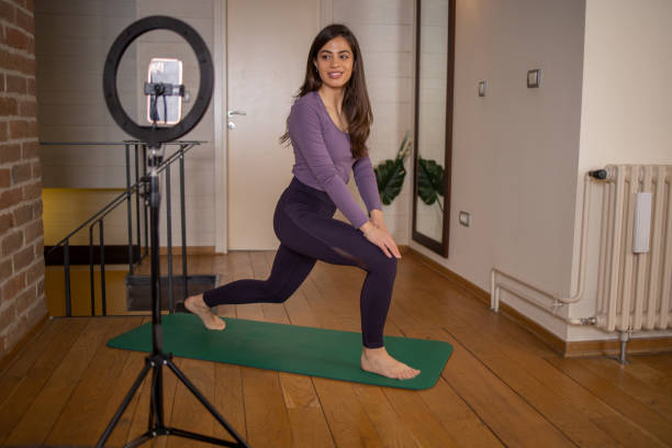 istock Woman is recording a vlog about exercise 1664404806