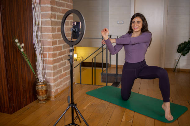 istock Fit young woman is filming a video about working out 1664404816