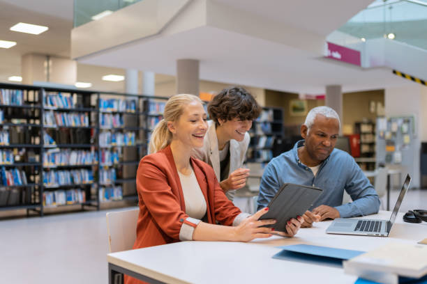 istock Readers and students in the library 1664405852