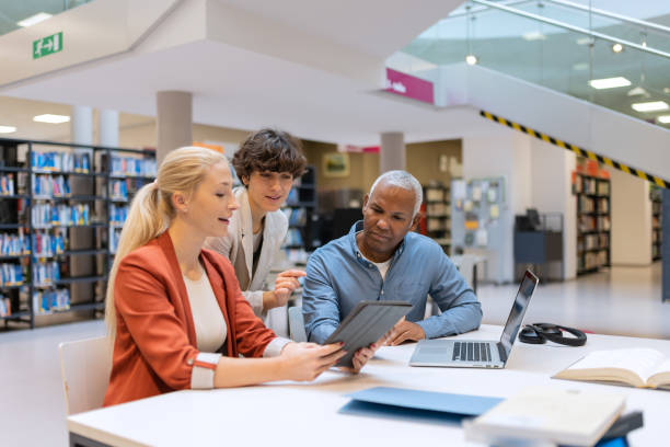 istock Readers and students in the library 1664405853
