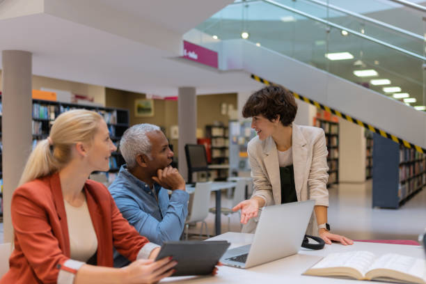istock Readers and students in the library 1664405858