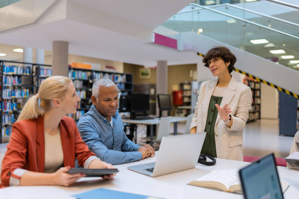 istock Readers and students in the library 1664405859