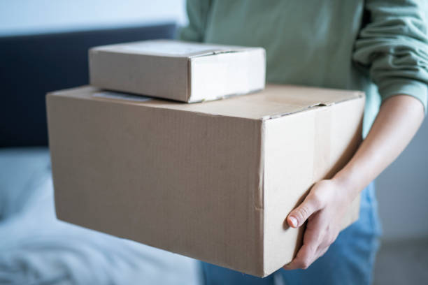 istock Woman holding boxes she ordered from the Black Friday sale. 1664416631