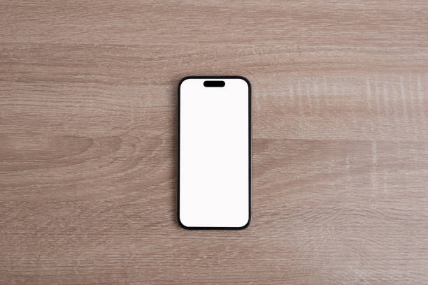 istock Mobile phone on the wooden floor. 1664423868